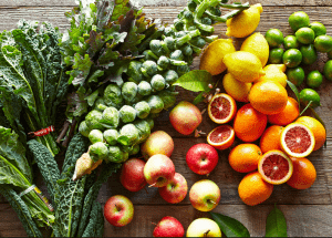 a group of fruits and vegetables on a wood surface Healthy Weight Loss Diets Islington